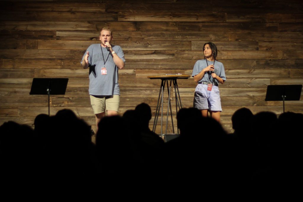 Two students lead Downtown Singing The Bison